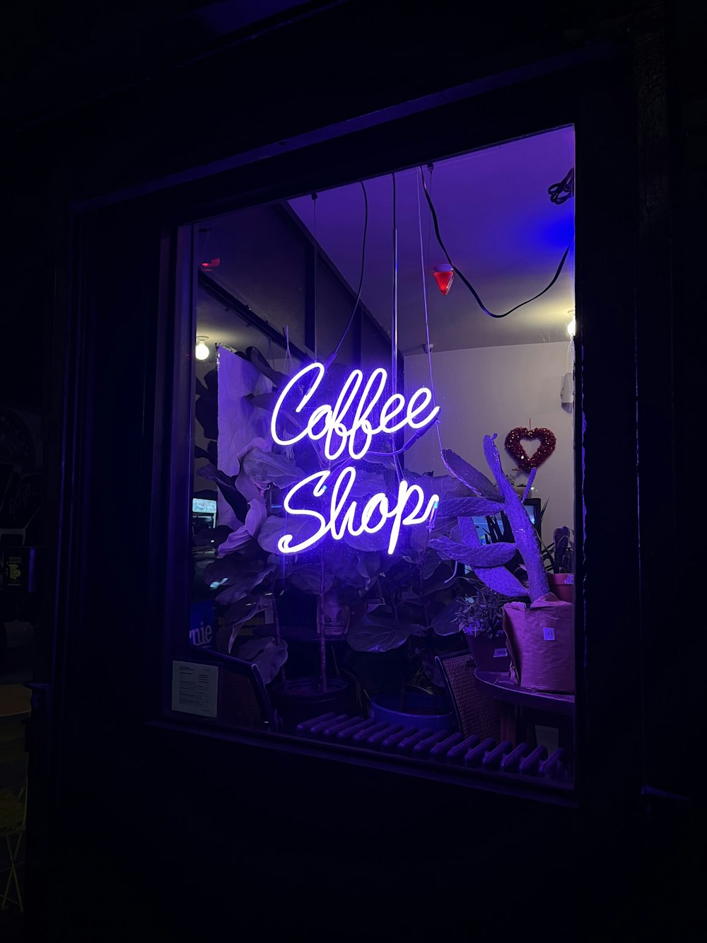 a purple neon sign that reads coffee shop