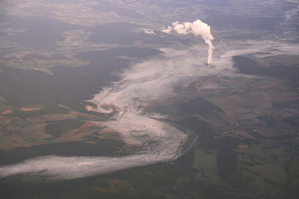 an aerial view of a river running through a field