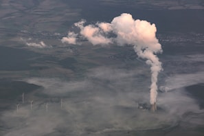 Aerial view of a waste-to-energy plant surrounded by green fields