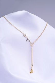 a gold necklace with a star and a star on it
