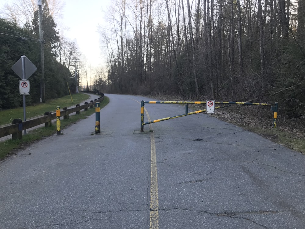 a road blocked off by a yellow barricade