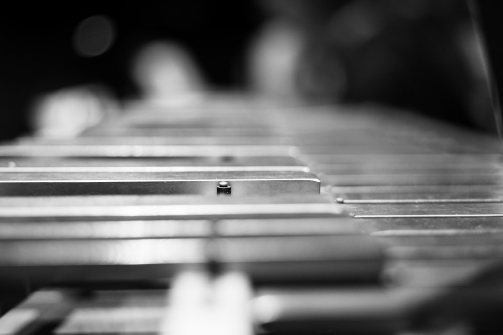 a black and white photo of a row of metal shelves