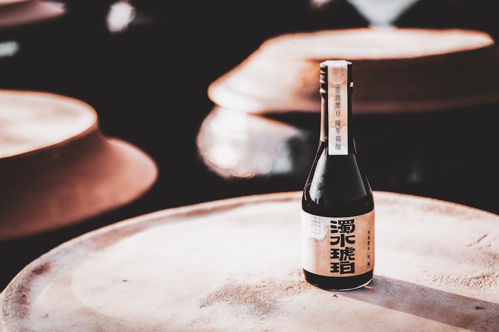 a bottle of beer sitting on top of a table