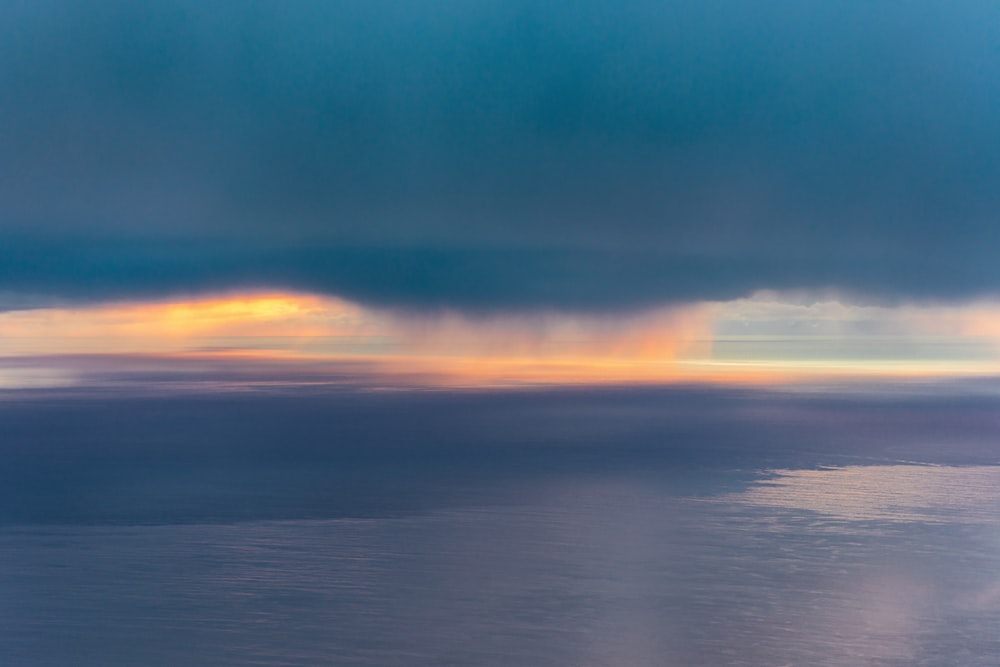 a view of a large body of water under a cloudy sky