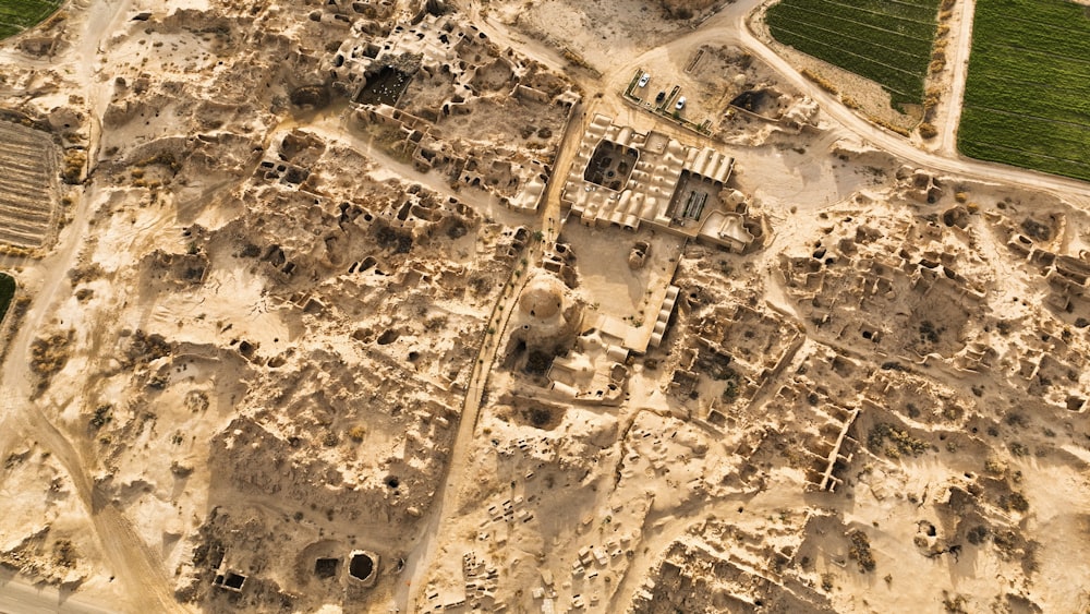an aerial view of a city with a lot of dirt