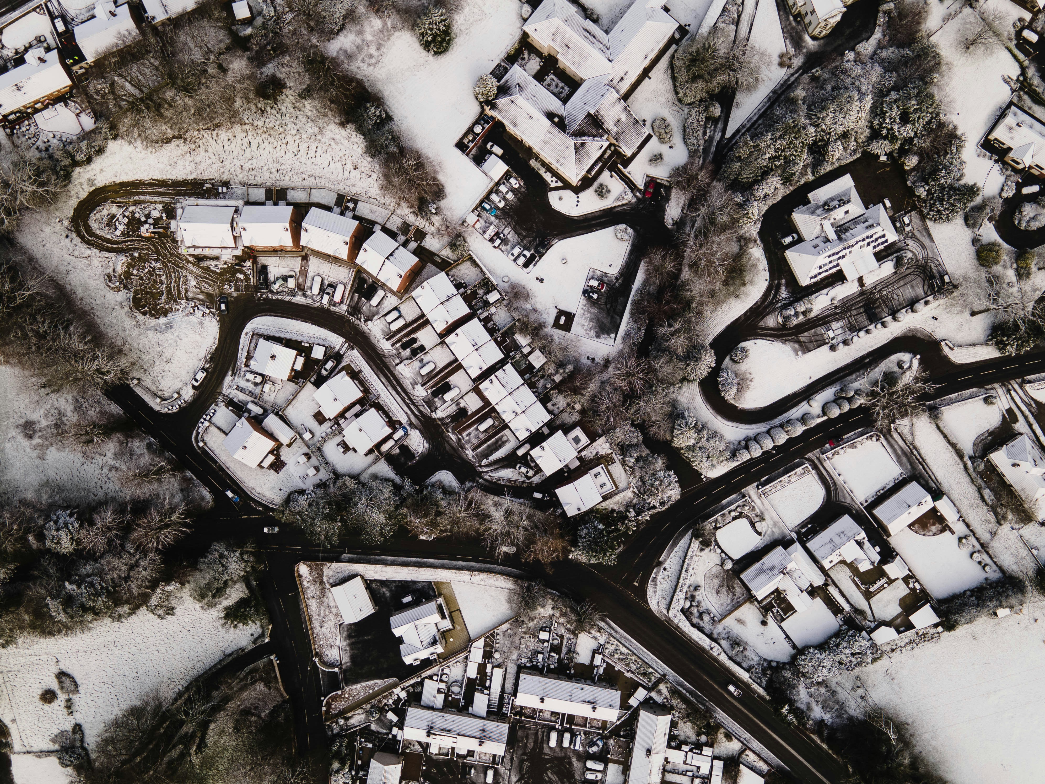 an aerial view of a snow covered city