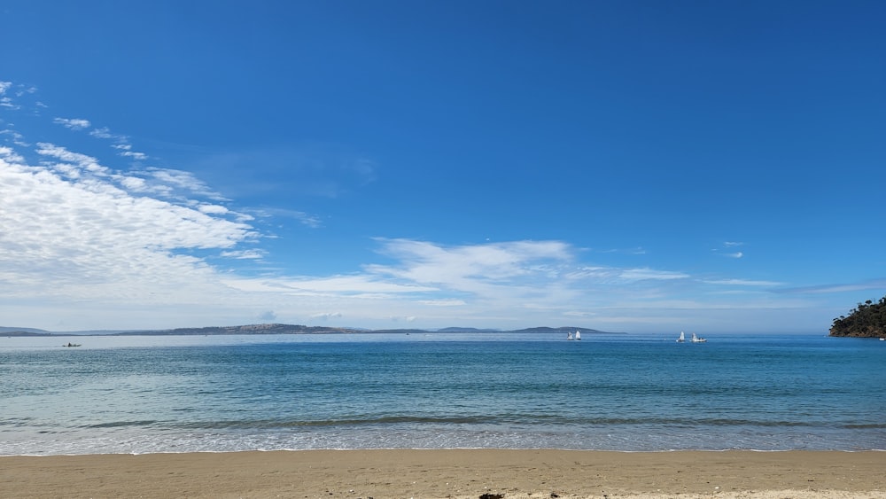 a view of a beach with boats in the water