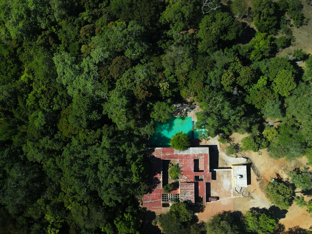 an aerial view of a house surrounded by trees