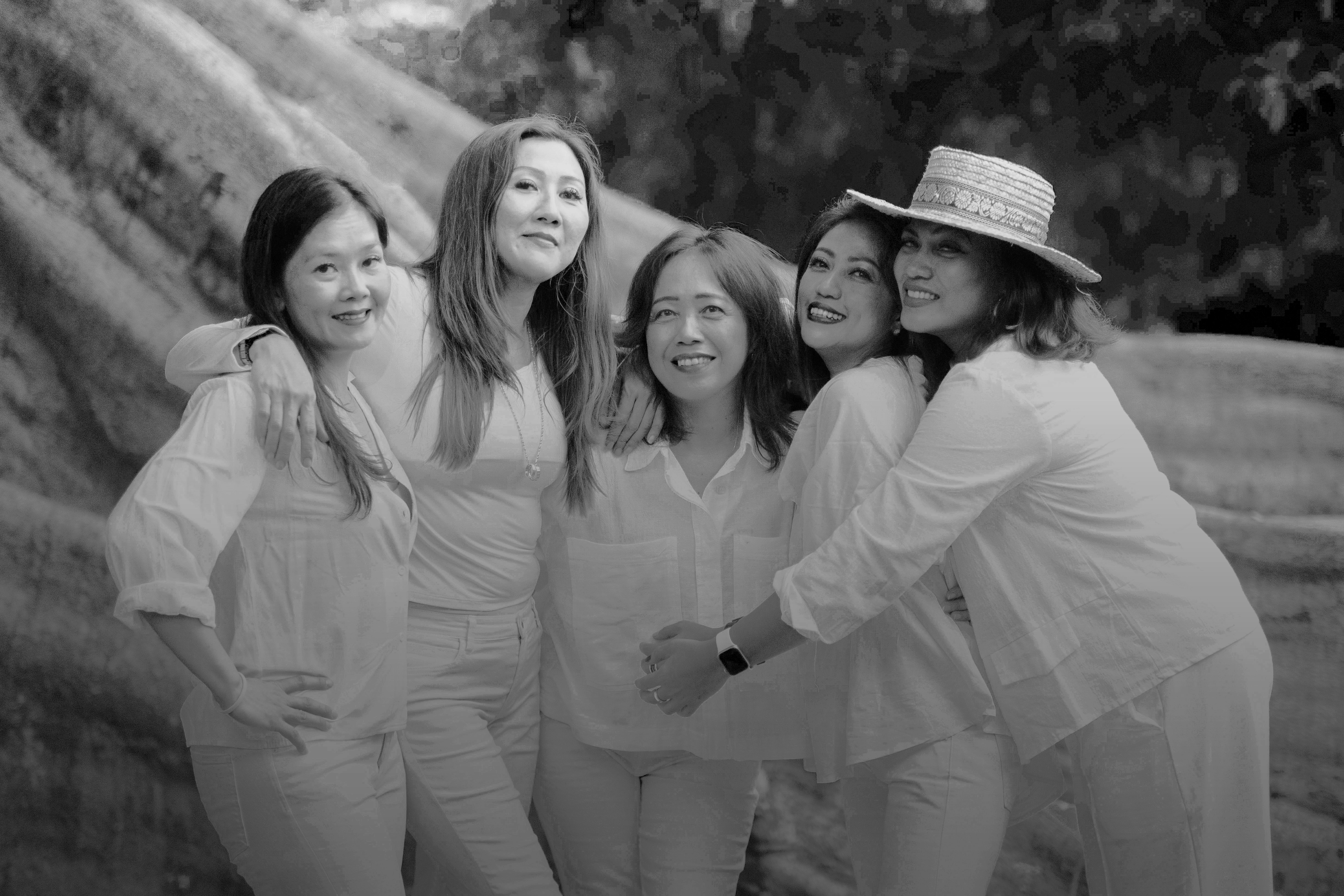 a group of women standing next to each other