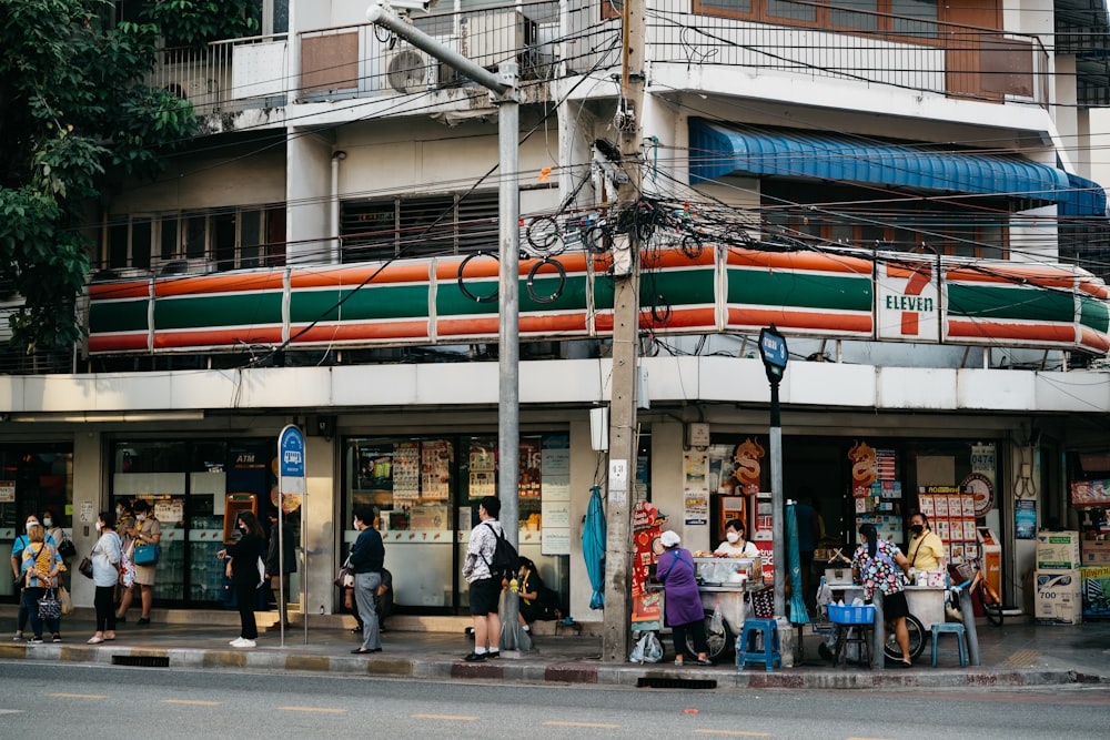 a group of people standing outside of a building