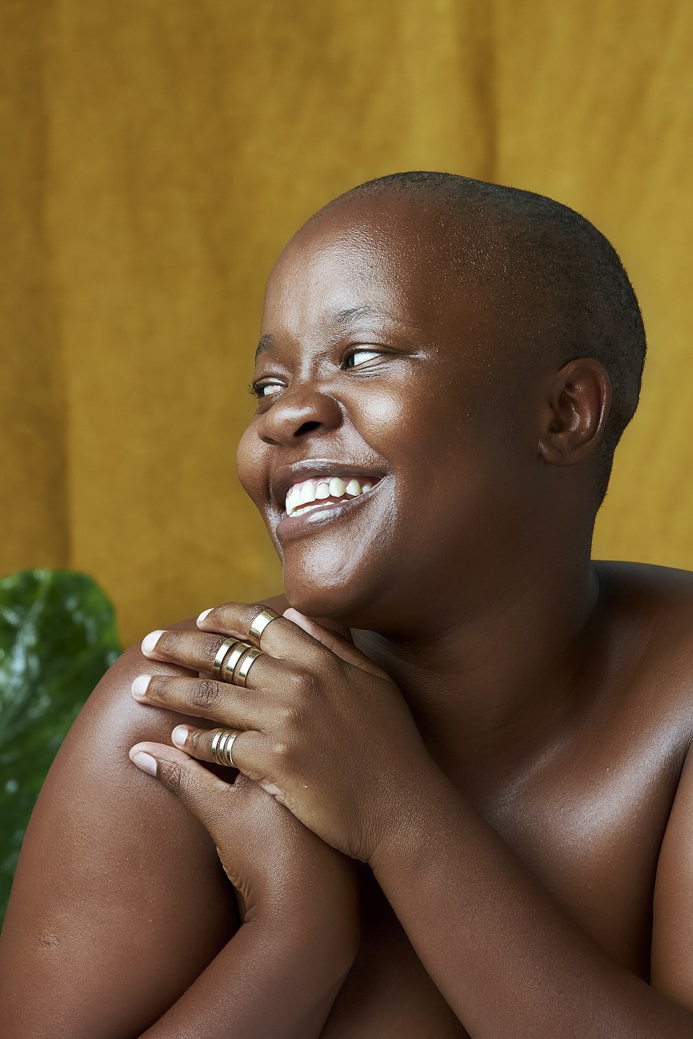 a black woman with her hands on her chest