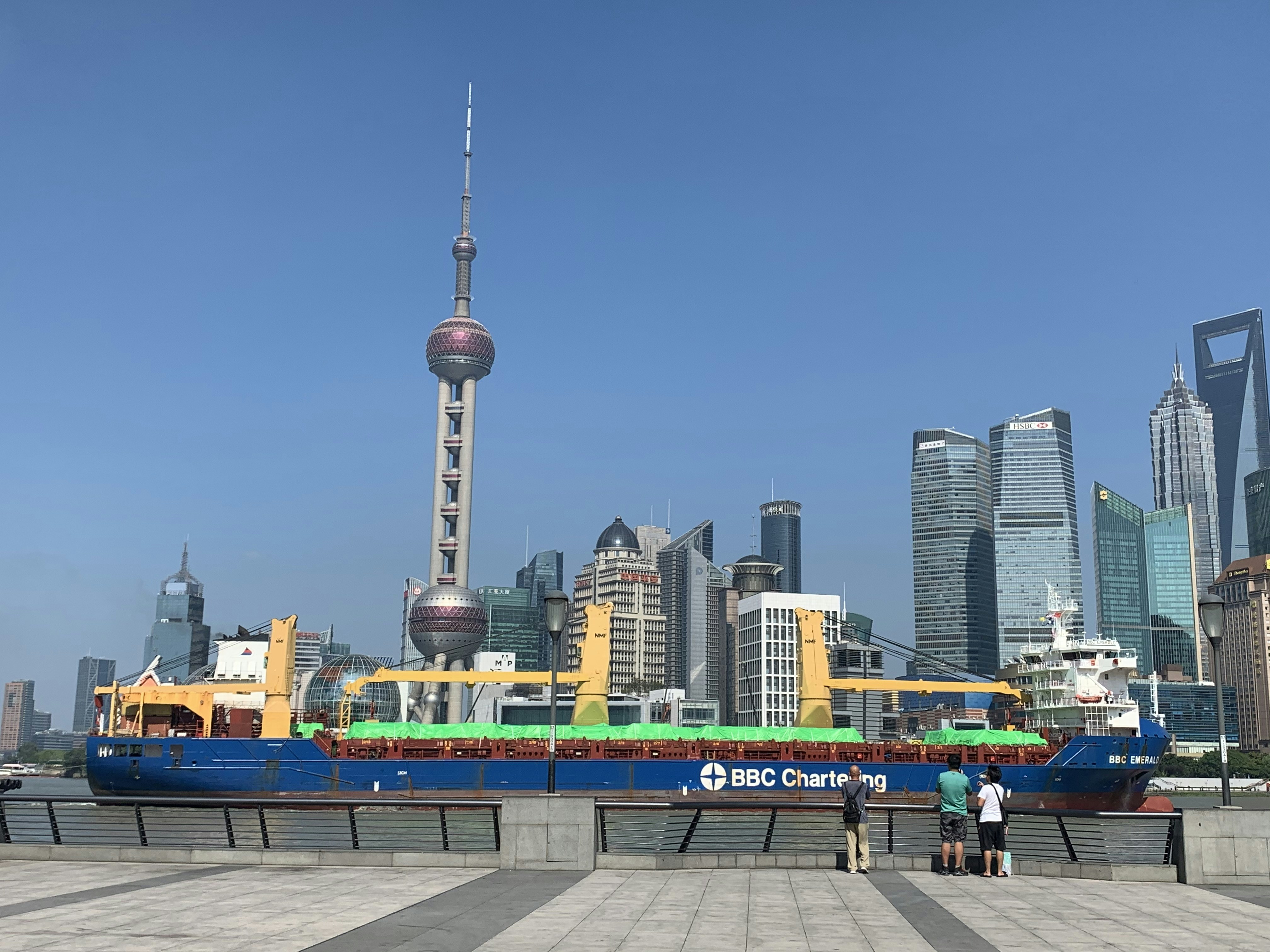 A large boat sitting in a harbor next to a city