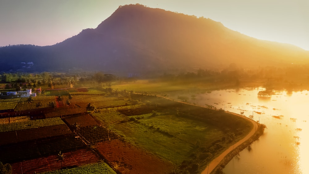 a river running through a lush green countryside