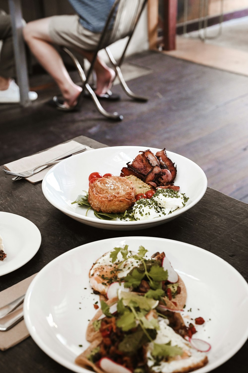 two plates of food are sitting on a table