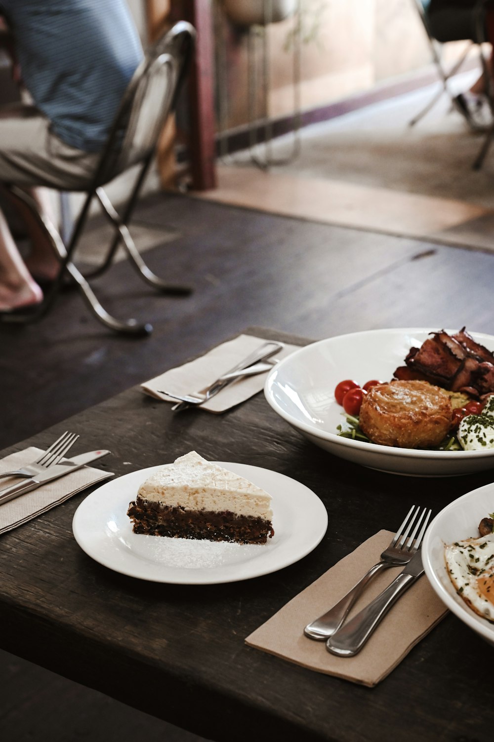 a table topped with plates of food and silverware