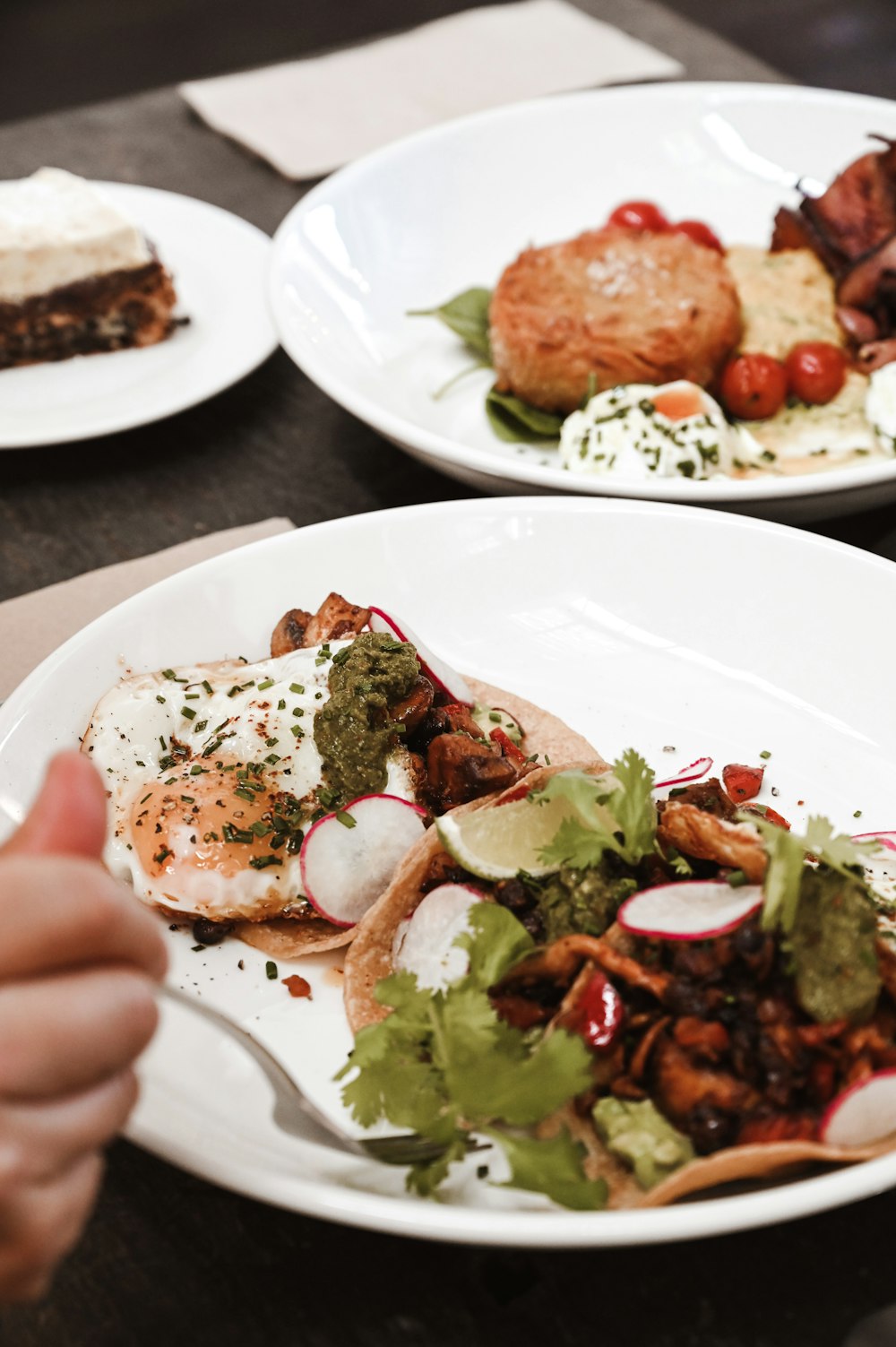 a plate of food on a table with other plates of food