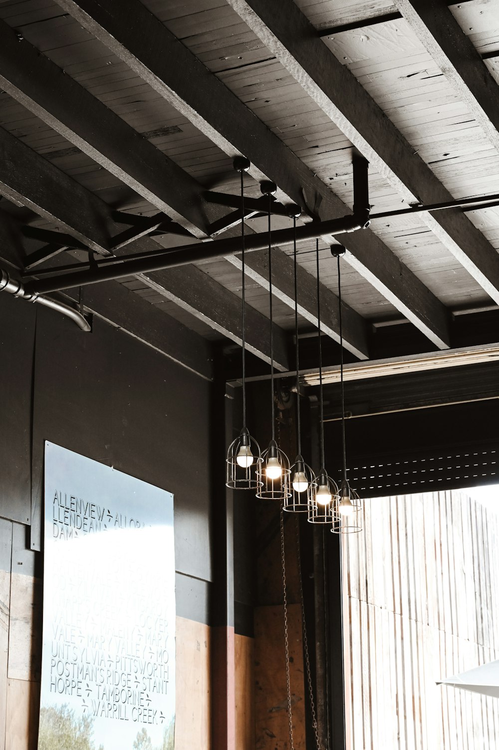 a room with a bunch of lights hanging from the ceiling