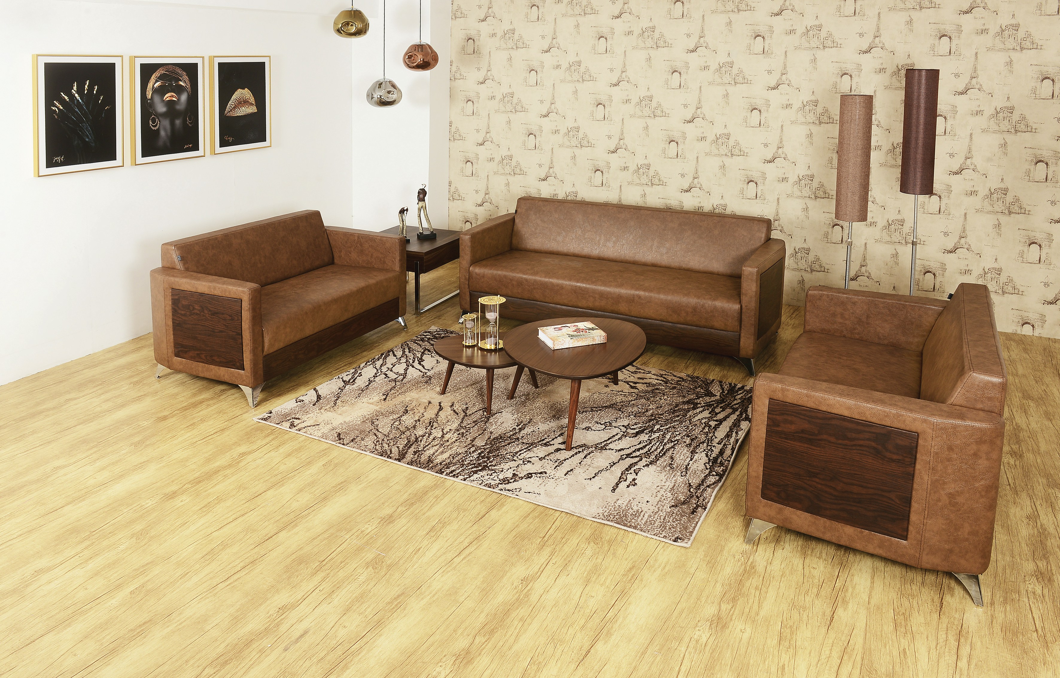 Brown leather sofa set arranged in a modern living room