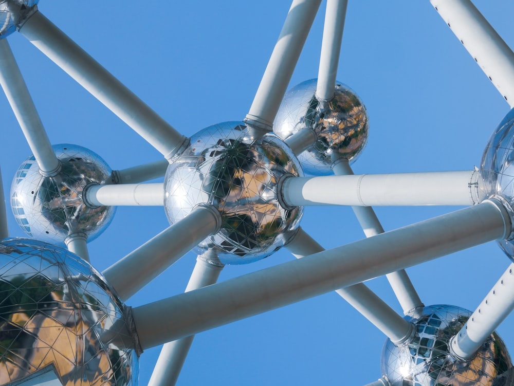 a close up of a metal structure with mirrored balls on it