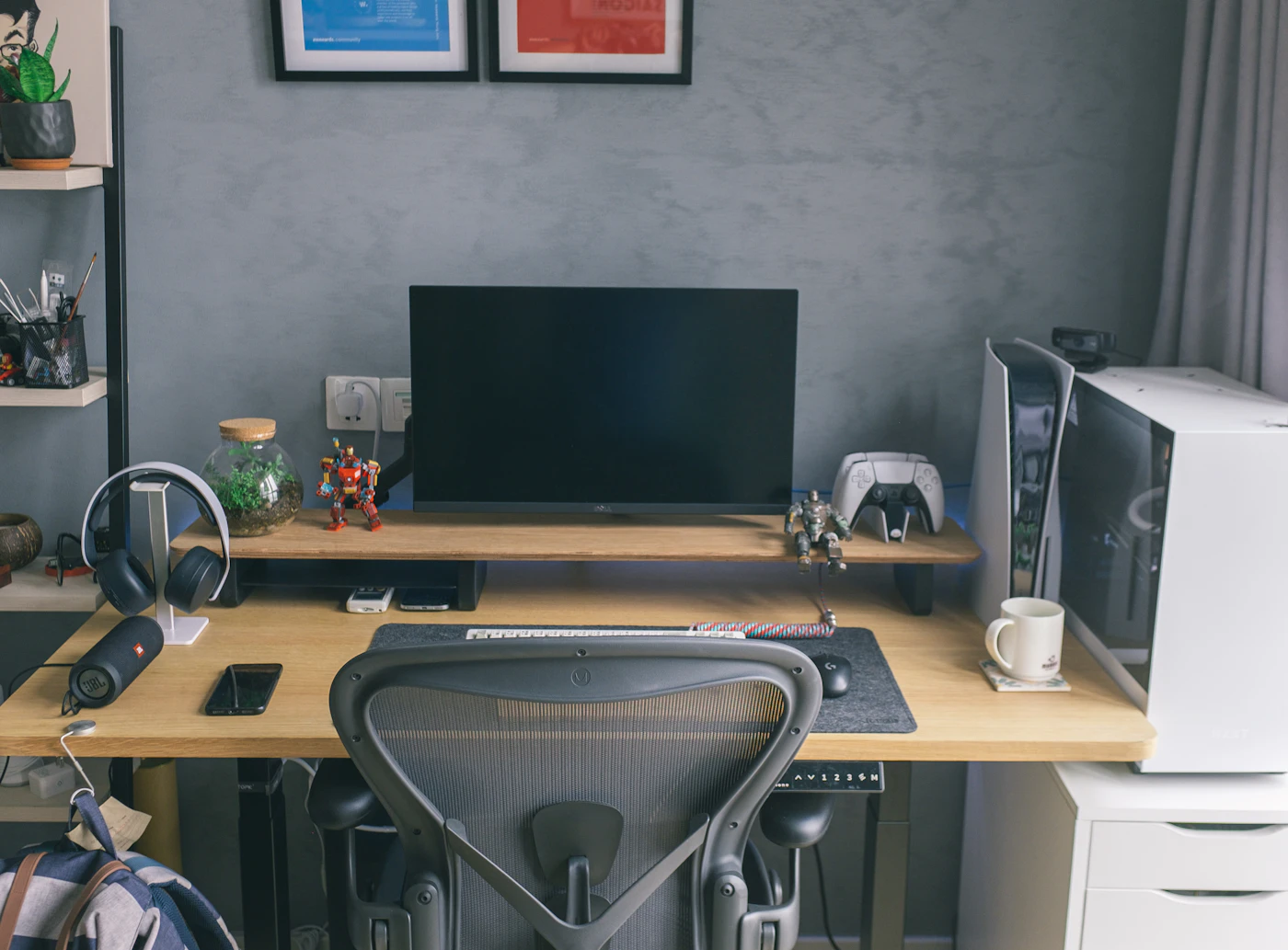 A grey home workstation with a computer and printer connected and ready to use