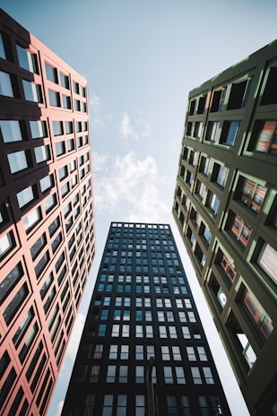 looking up at tall buildings in a city