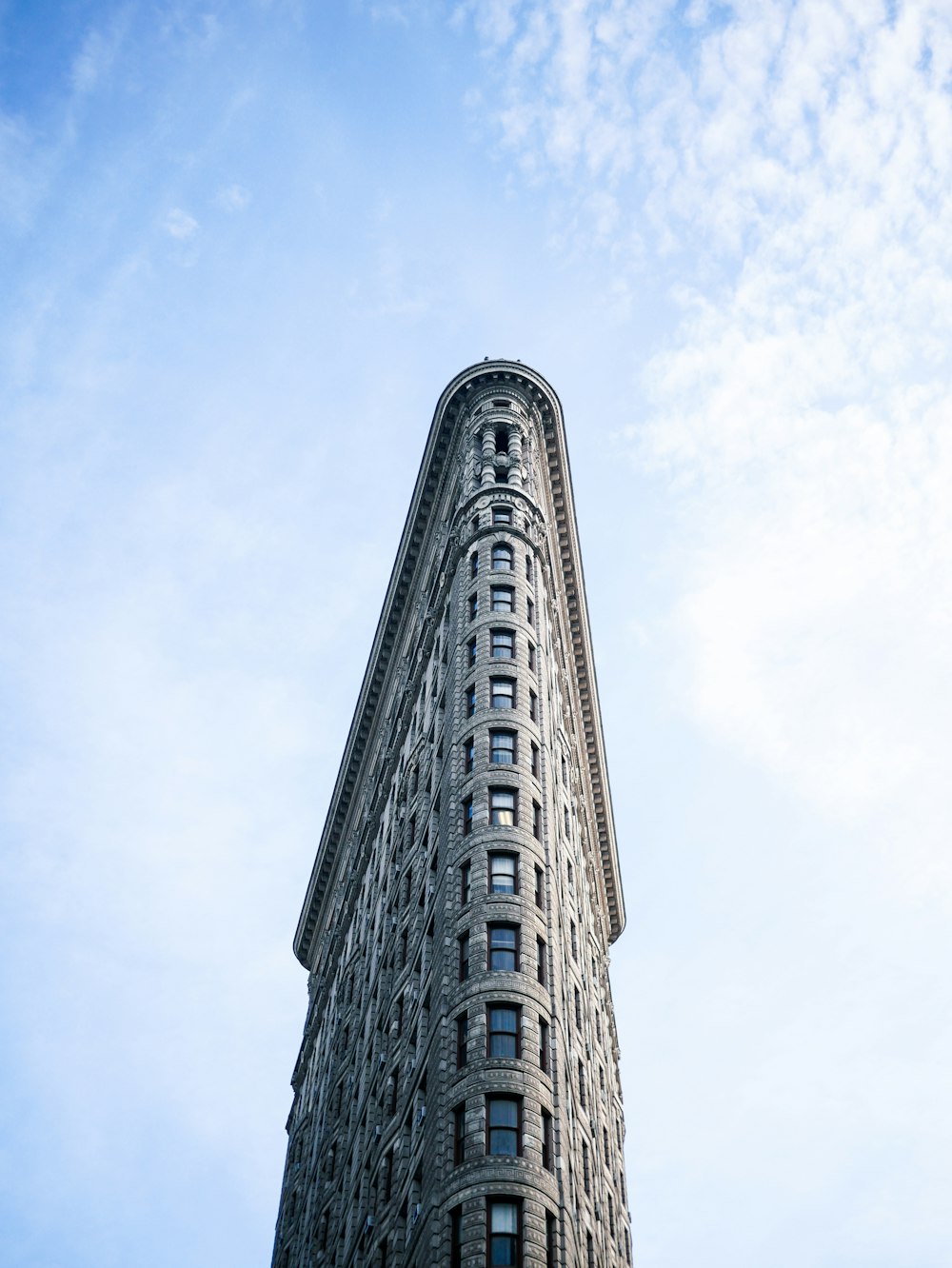 a very tall building with a sky background