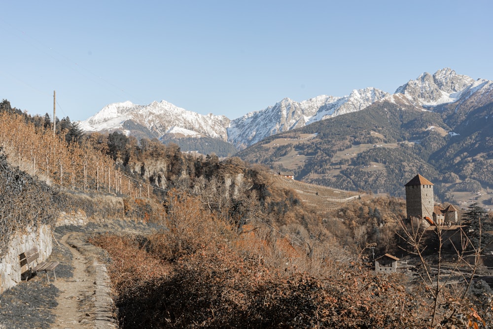 a view of a mountain range with a building in the foreground