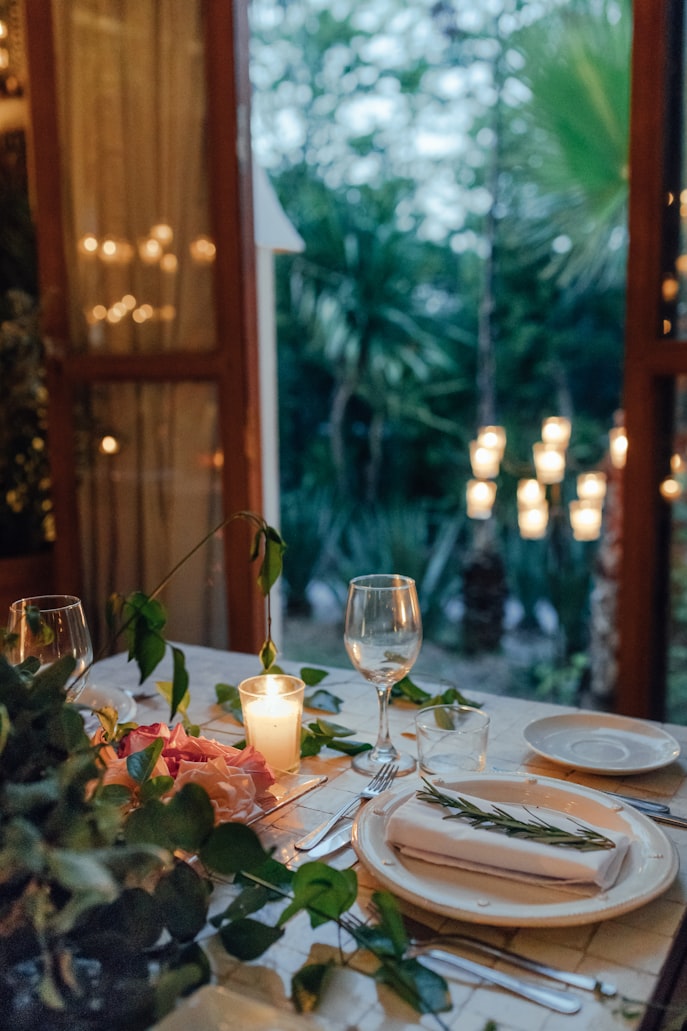 Elegant table setting with candles and fine dinnerware