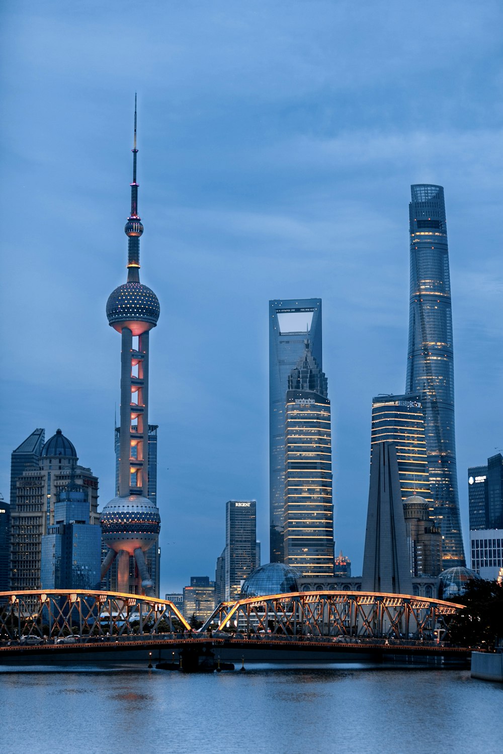 a city skyline with a bridge in the foreground