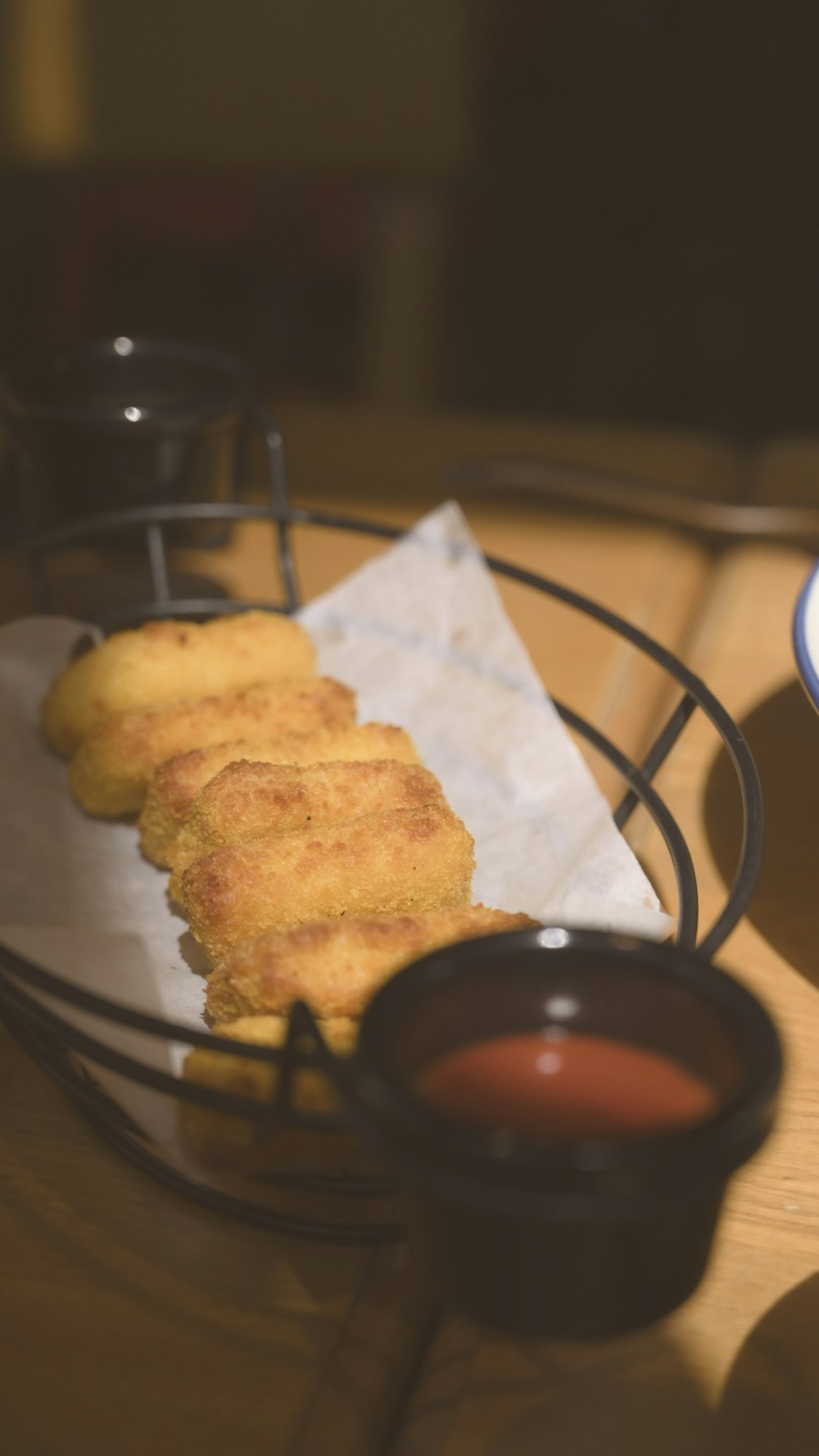 a plate of food on a table with dipping sauce