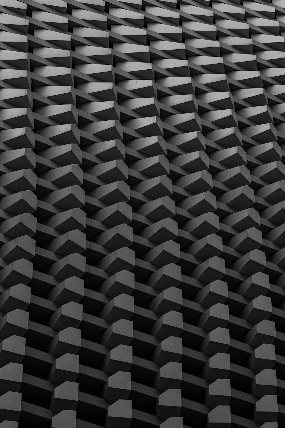 a black and white photo of a pattern of cubes