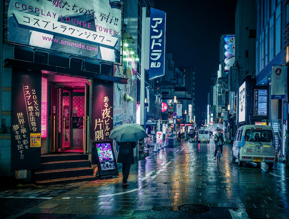 a person walking down a street holding an umbrella