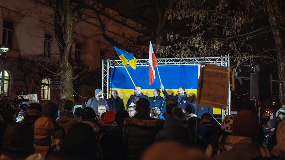 a group of people standing on top of a stage