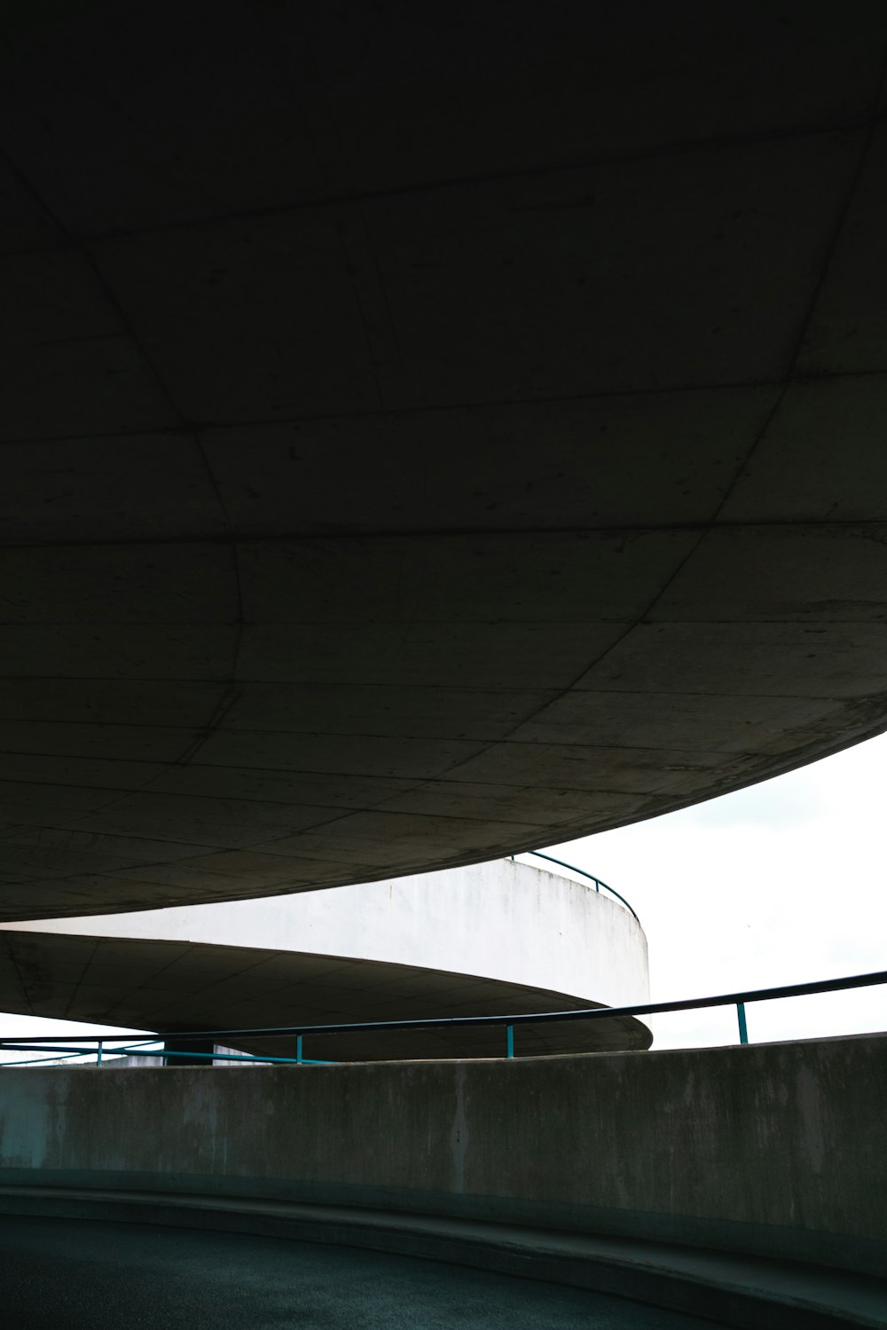 a man riding a skateboard down a curvy road