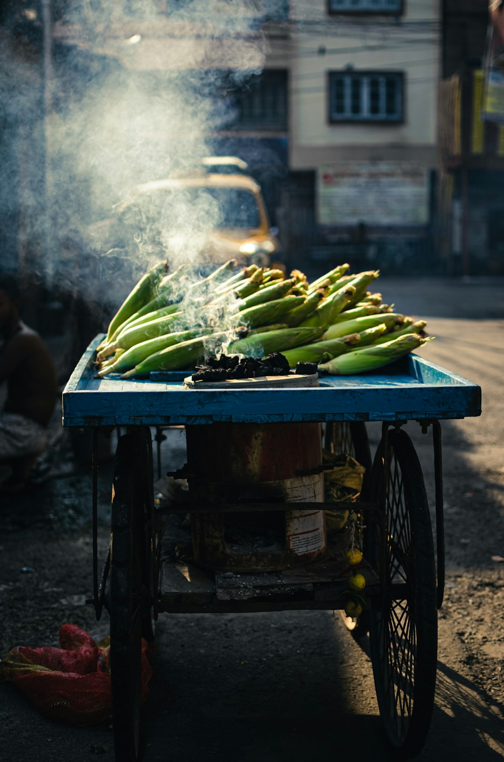 a cart with a bunch of bananas on top of it