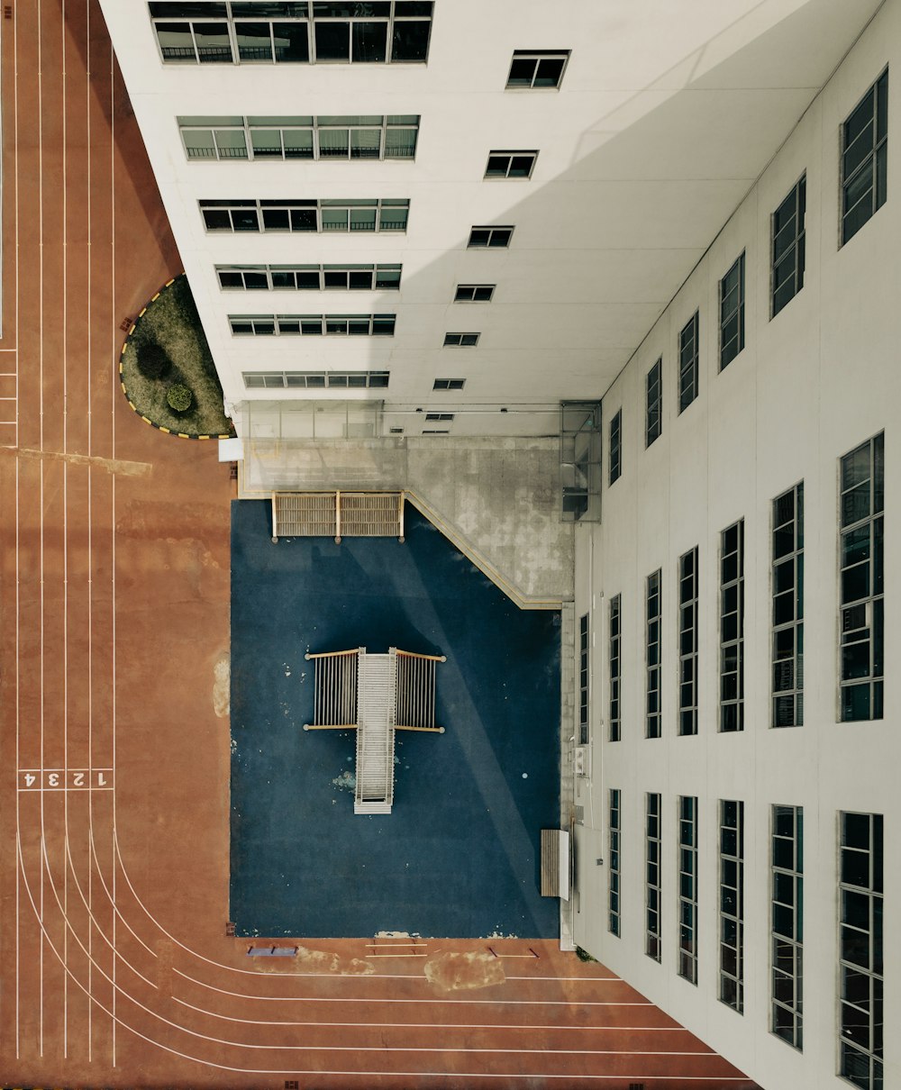 an overhead view of a building with a blue wall