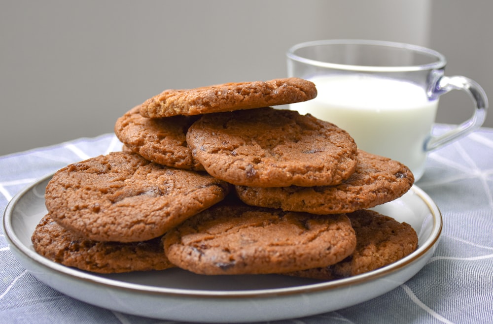 a plate of cookies and a glass of milk