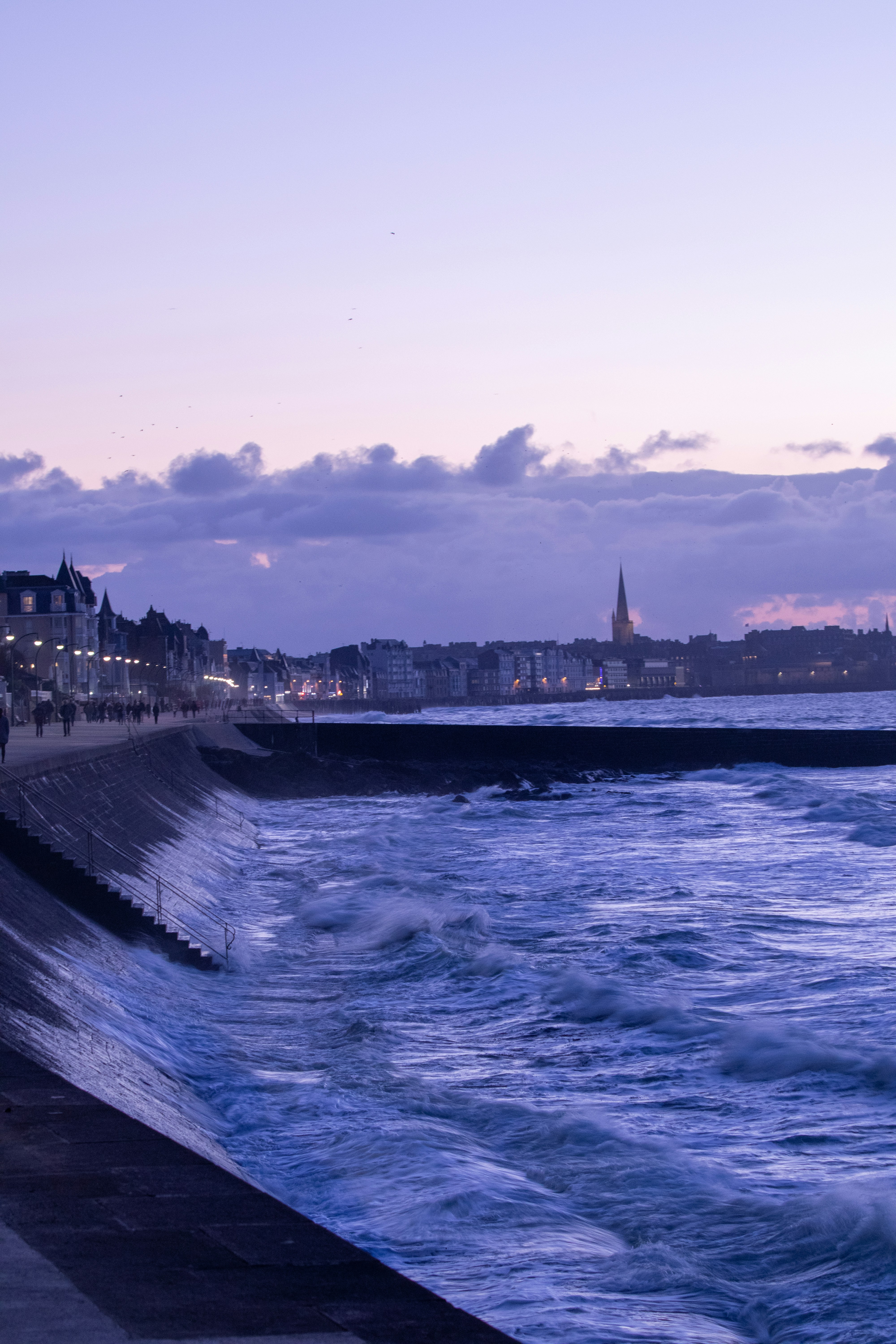 a view of a body of water with a city in the background