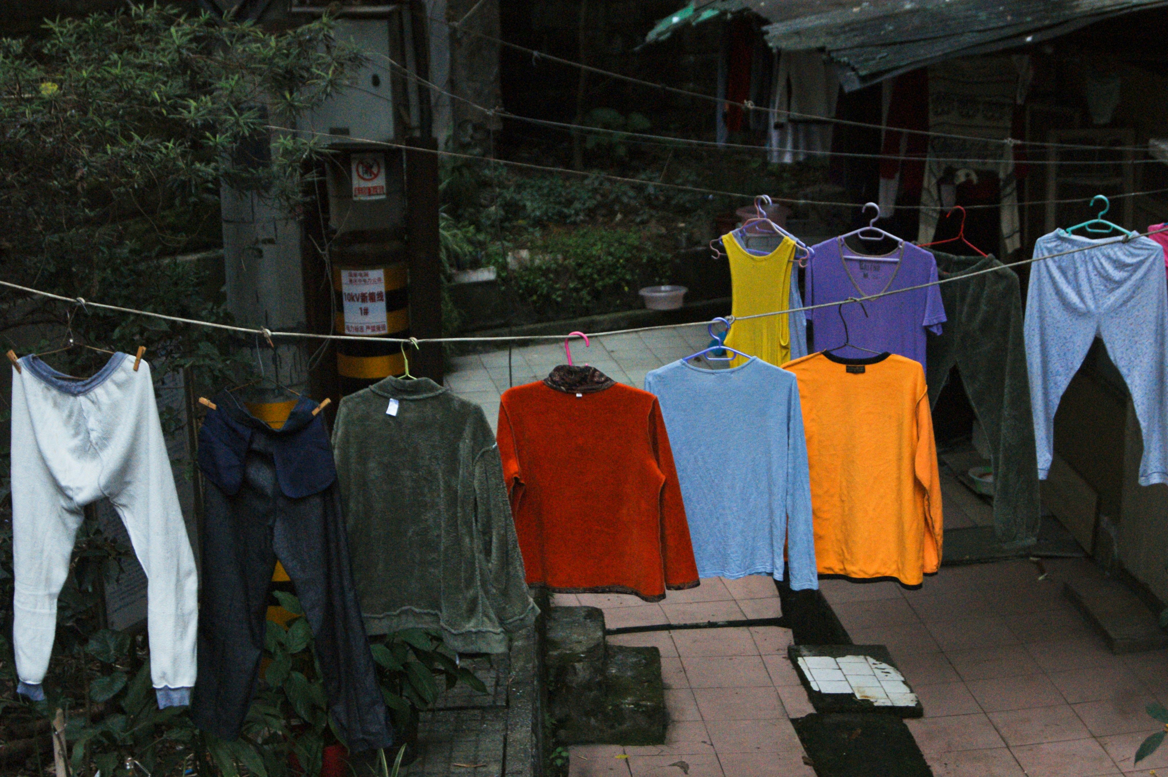 A line of clothes hanging on a clothes line photo Free Clothing Image