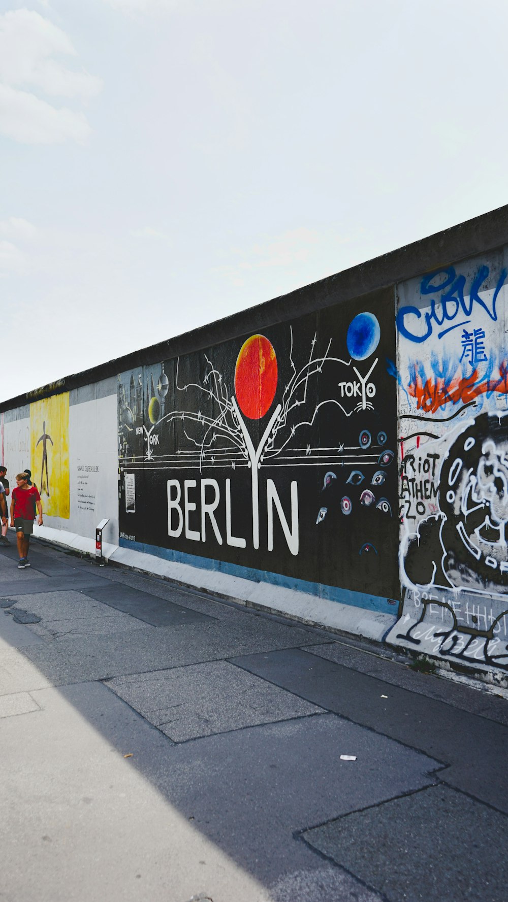 a wall with a bunch of graffiti on it