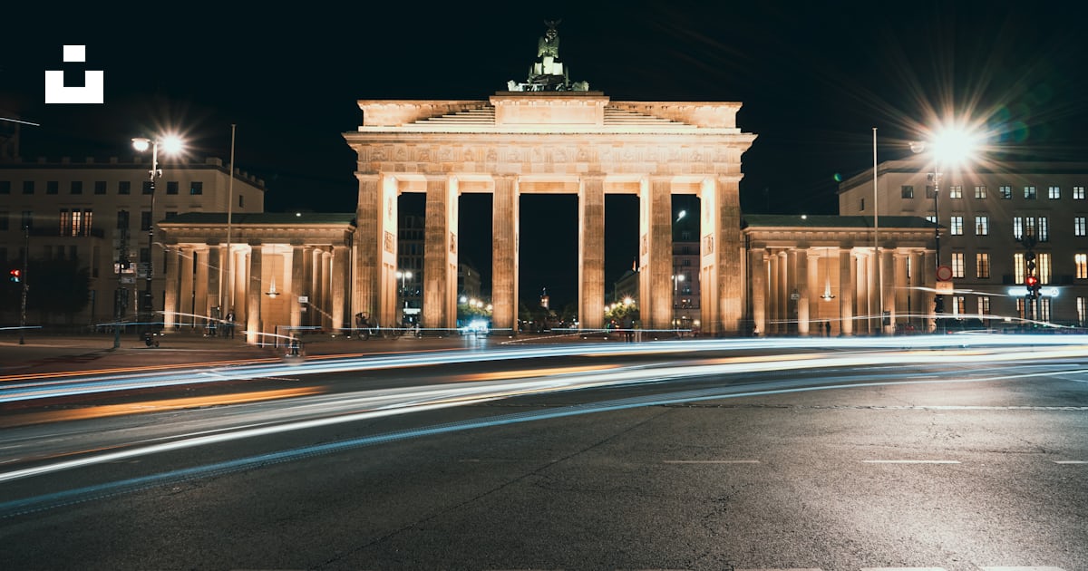 A very tall building with a clock tower on top of it photo – Free ...