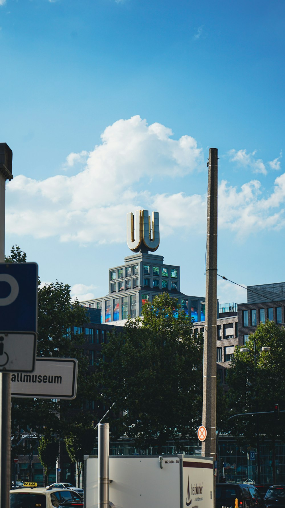 a city street with a tall building in the background