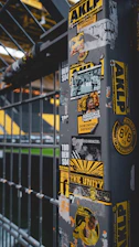 a pole with a bunch of stickers on it