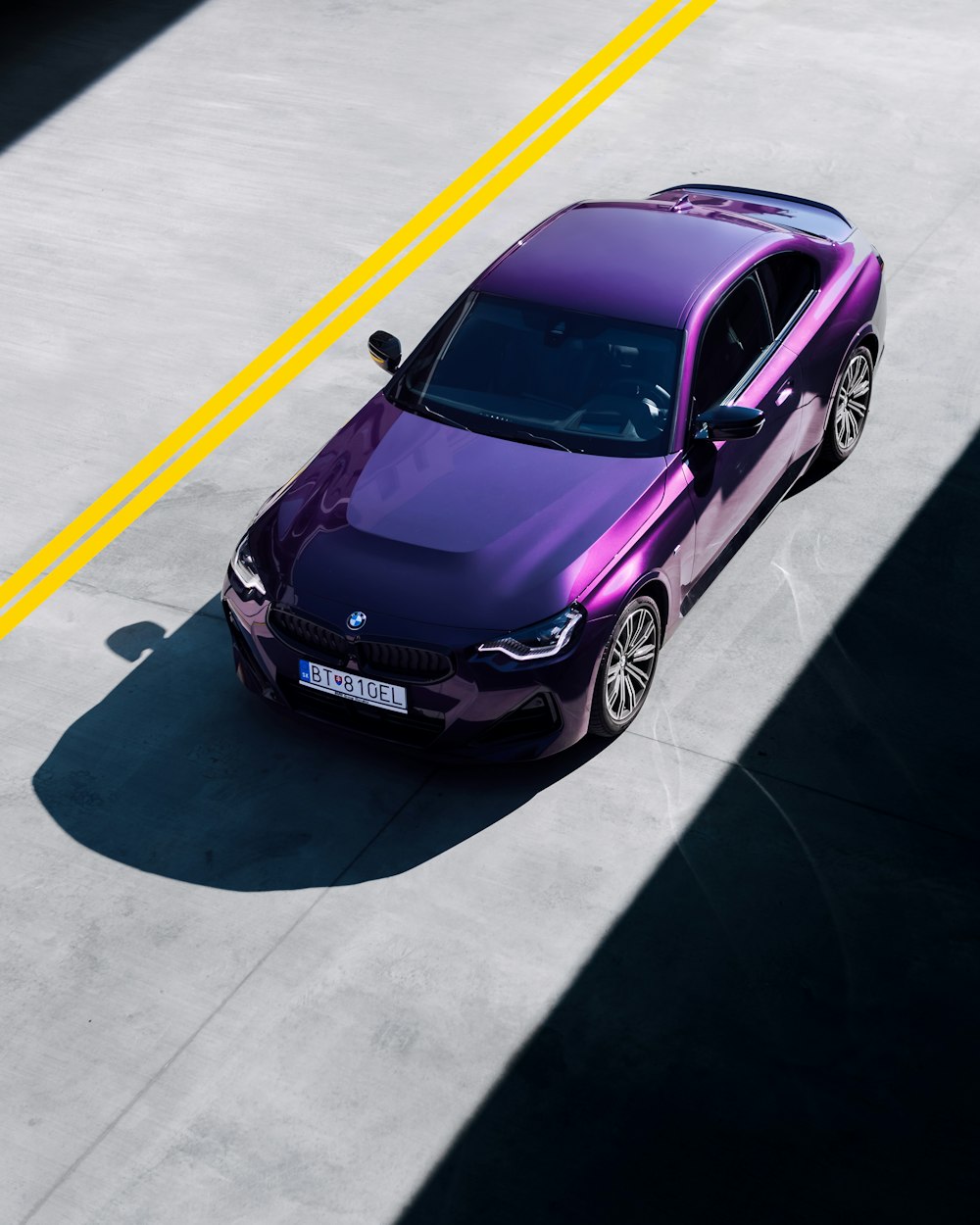 a purple car parked in a parking lot