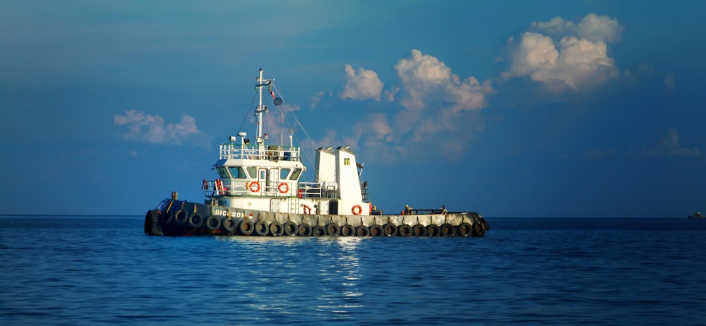 a tug boat in the middle of the ocean