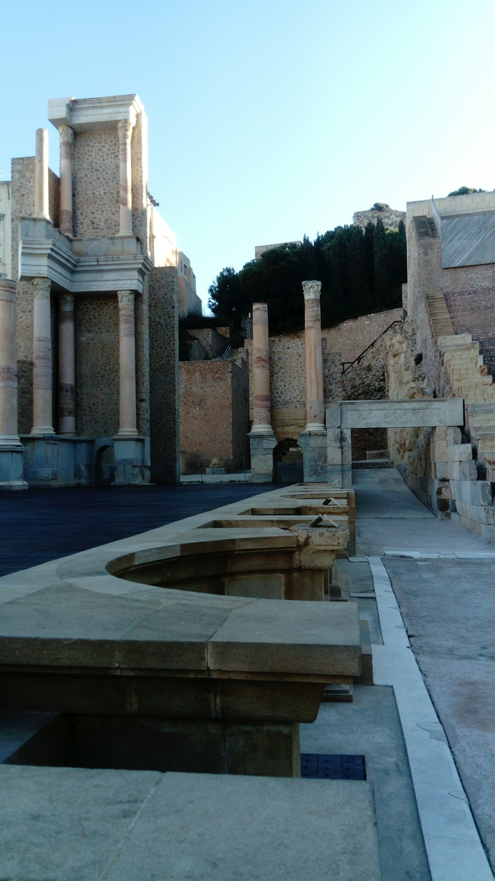 a row of stone benches sitting next to each other