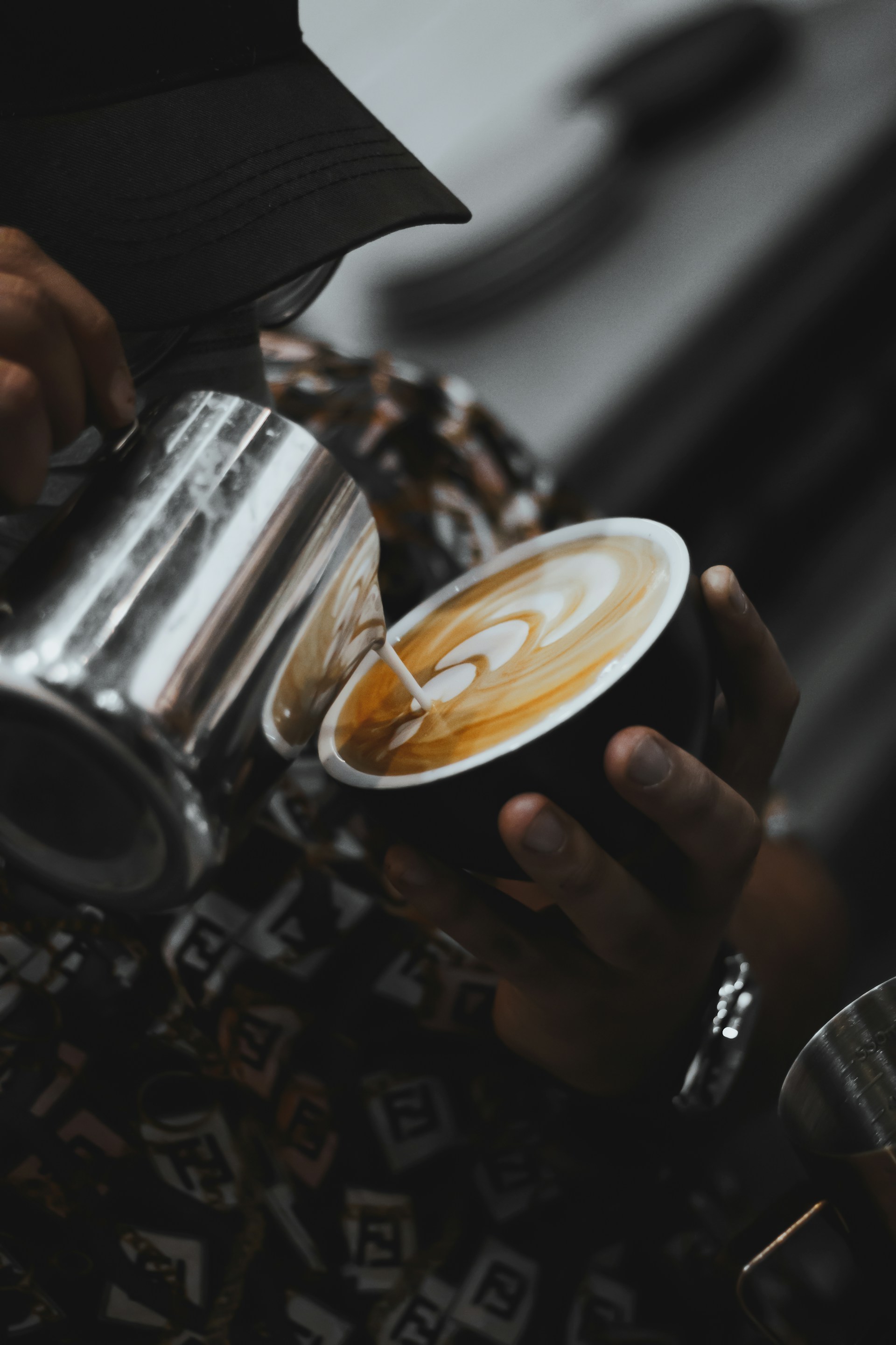 a person is holding a cup of coffee