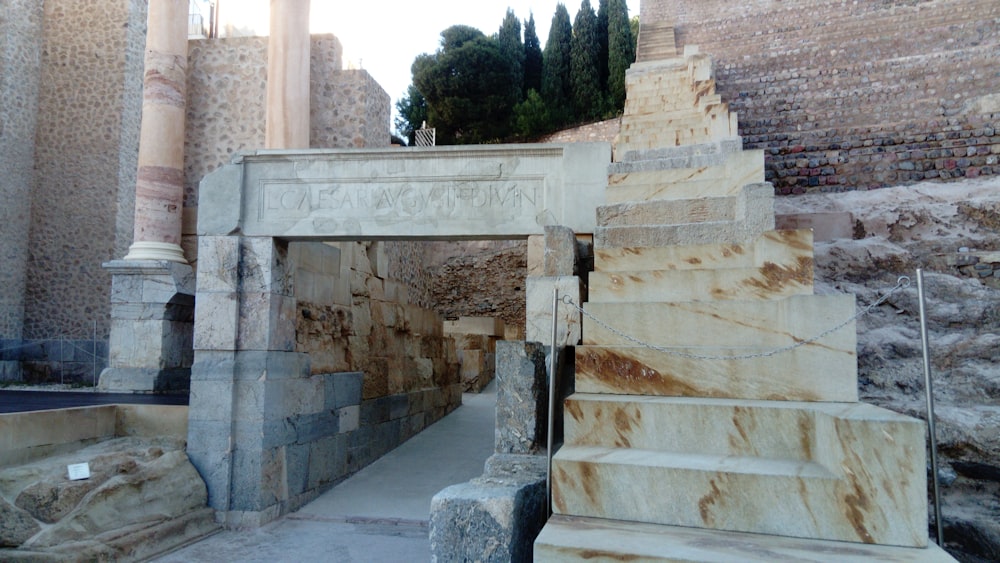 a stone structure with steps leading up to it