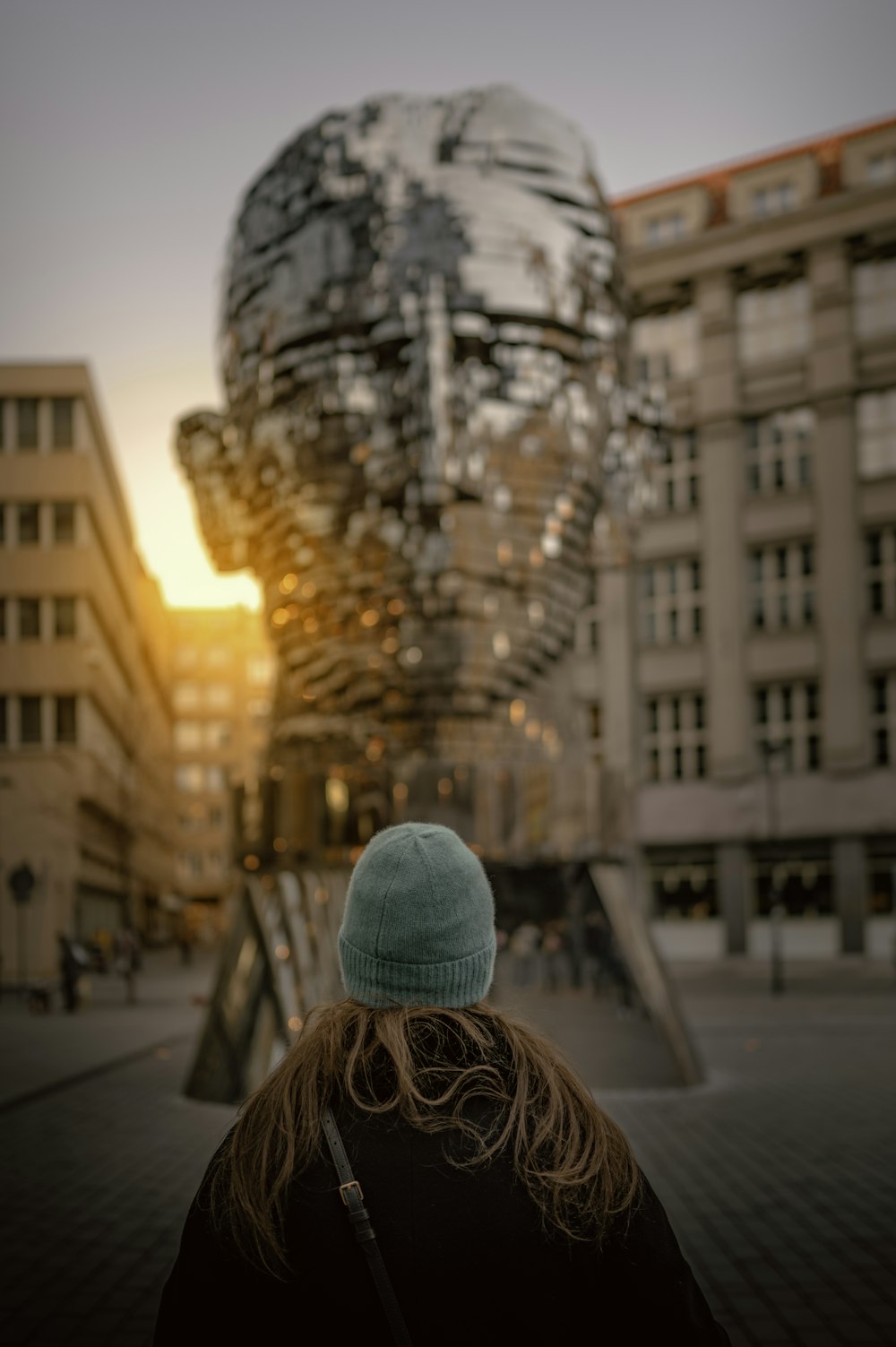 a person standing in front of a large building