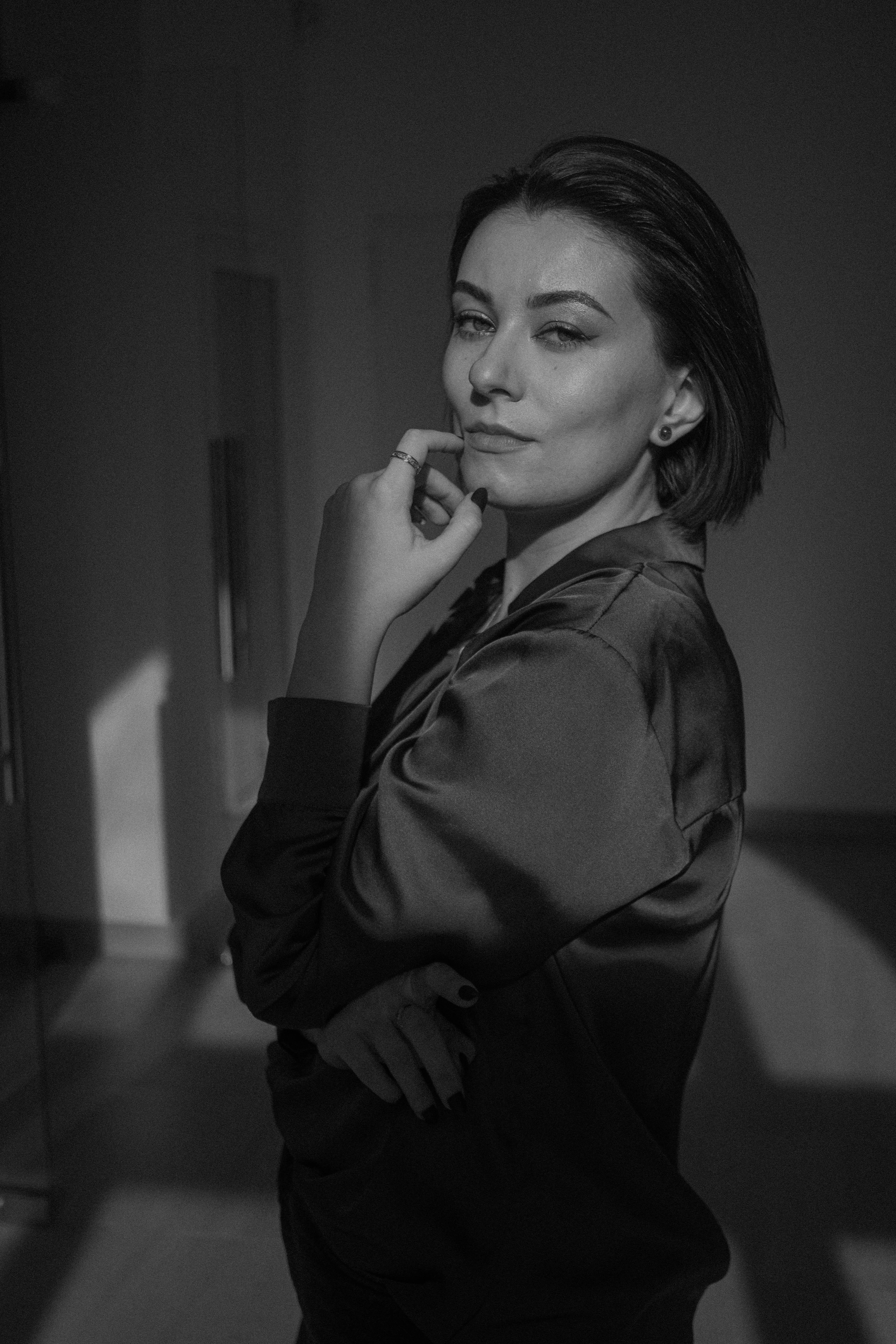 a black and white photo of a woman posing for a picture
